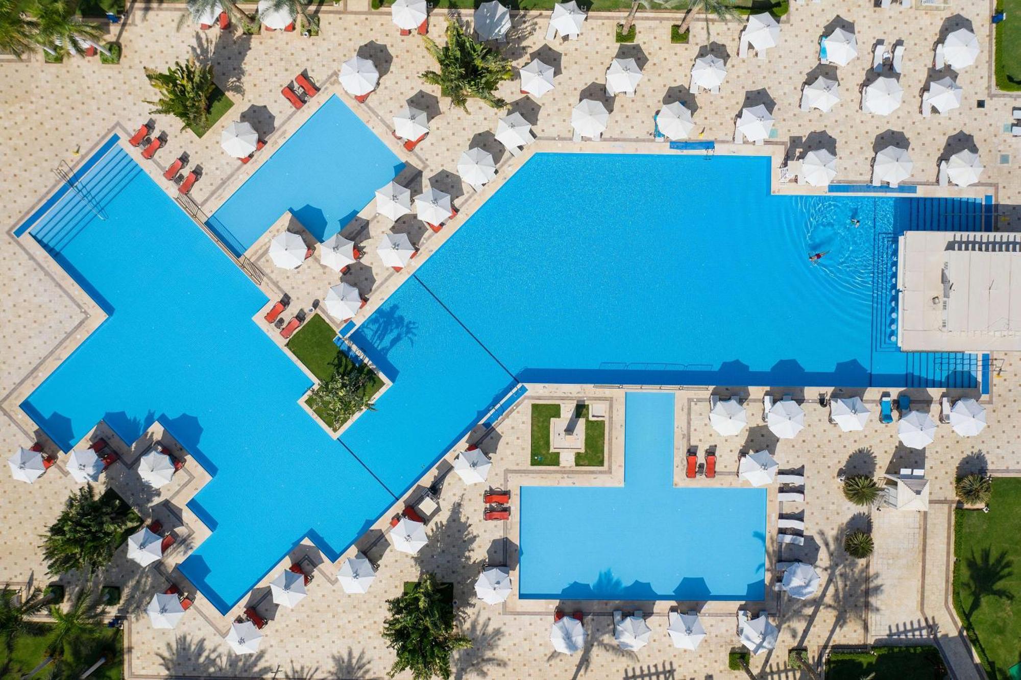 Rixos Sharm El Sheikh (Adults Only) Hotel Exterior photo Aerial view of a pool at a resort in Cancun, Mexico